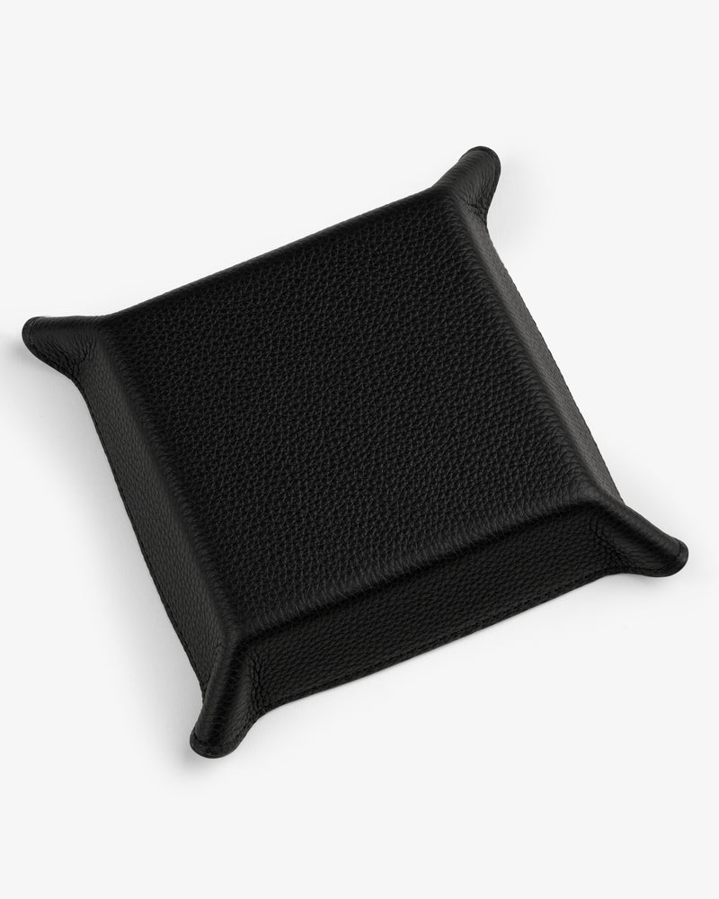 A black, square Leather Catchall with raised edges and pointed corners on a white background.