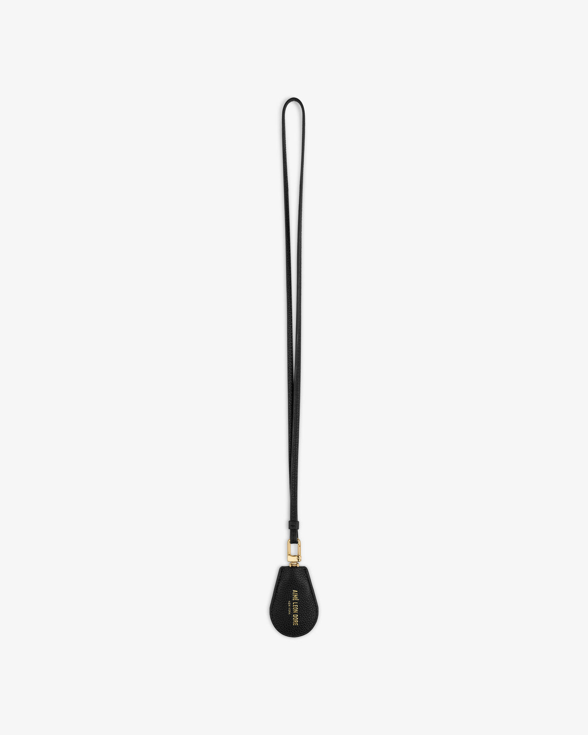 A black Leather Key Cover with gold hardware and text on the teardrop end, shown on a white background.