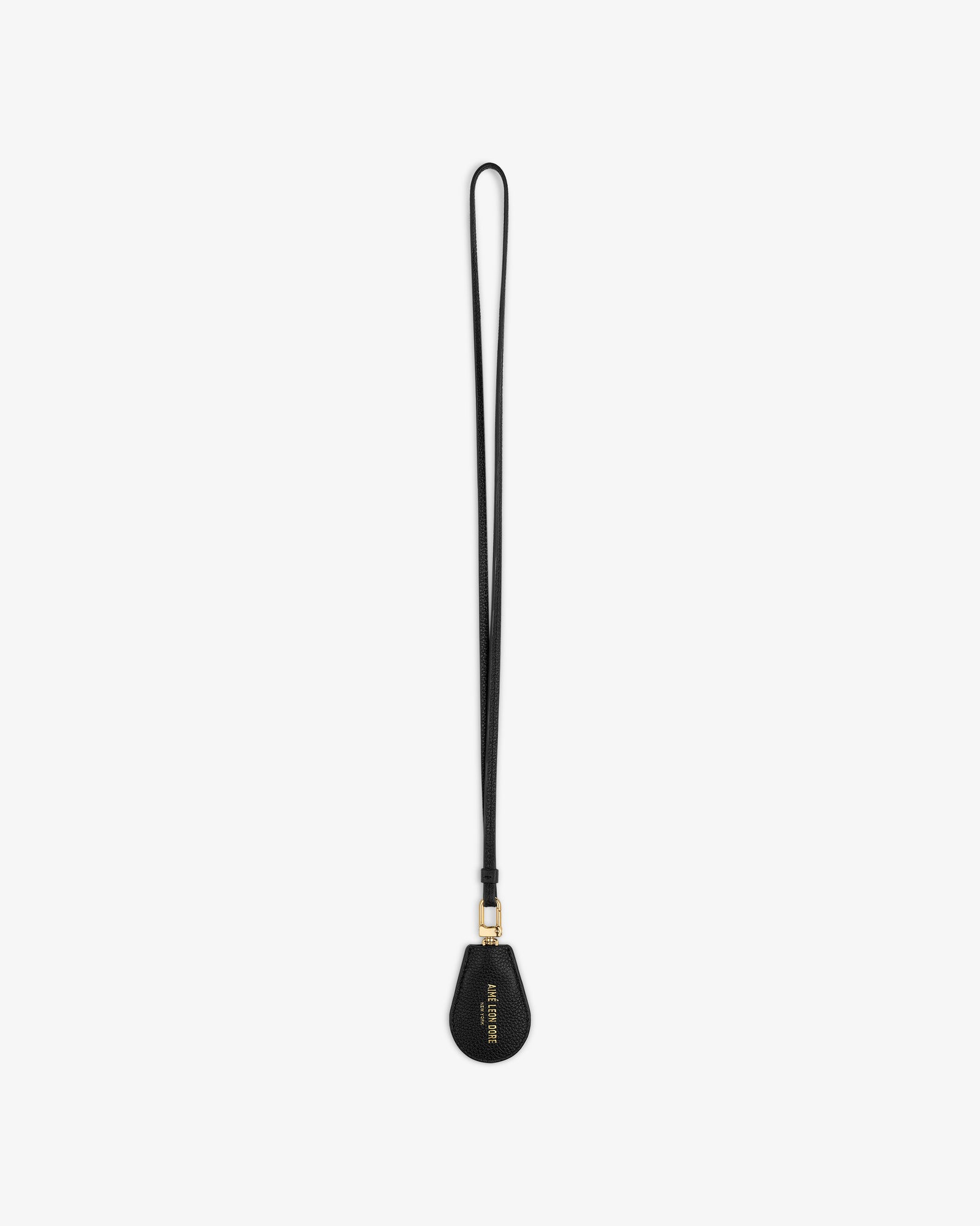 A black Leather Key Cover with gold hardware and text on the teardrop end, shown on a white background.