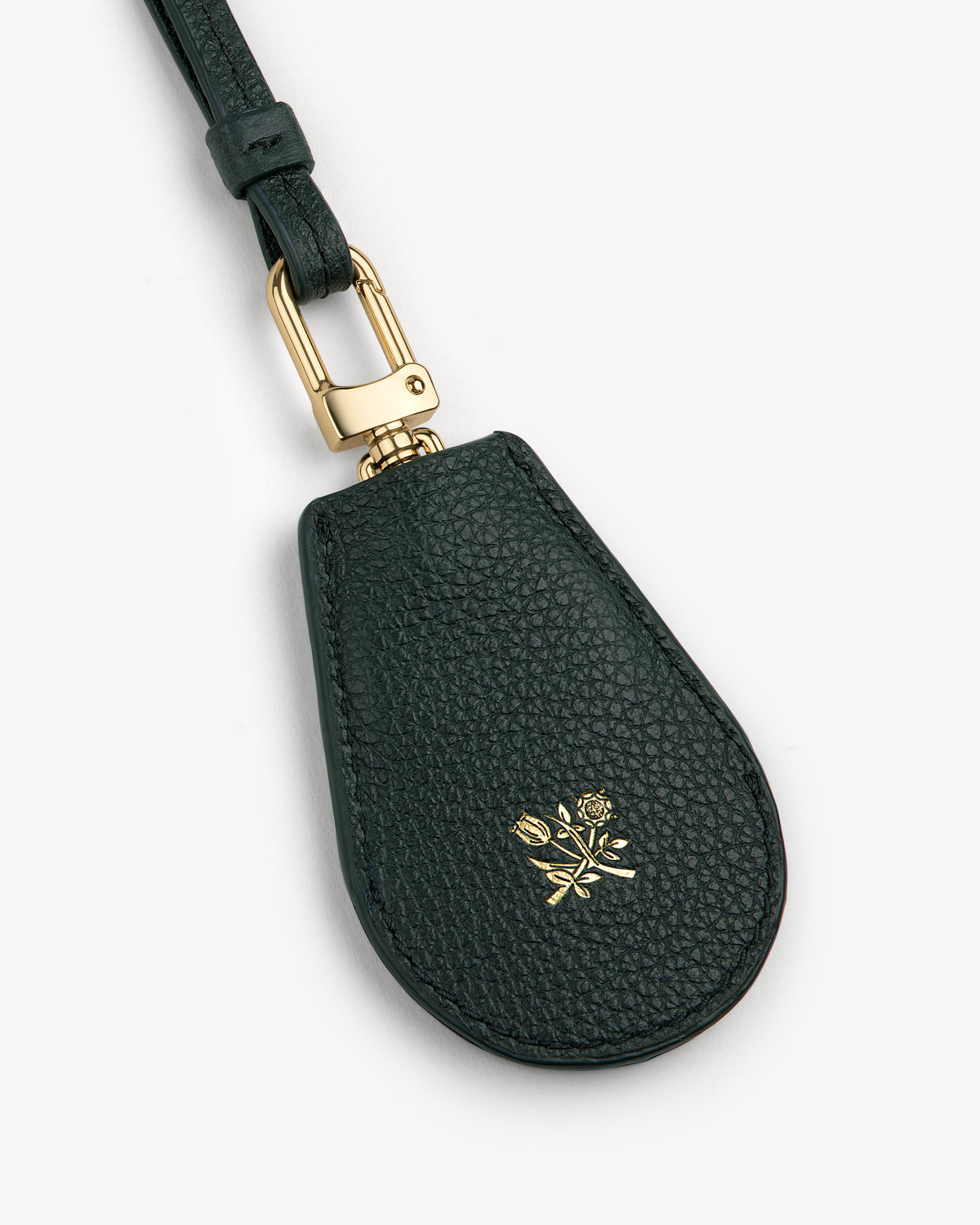 Leather Key Cover in black with gold clasp and a small embossed gold rose emblem on the front.