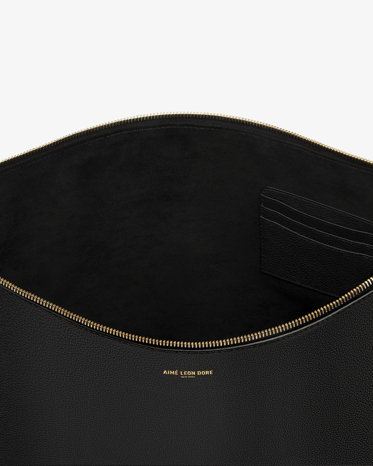 Open Large Leather Pouch in black leather with gold zipper and "Aime Leon Dore" text, revealing card slots inside.