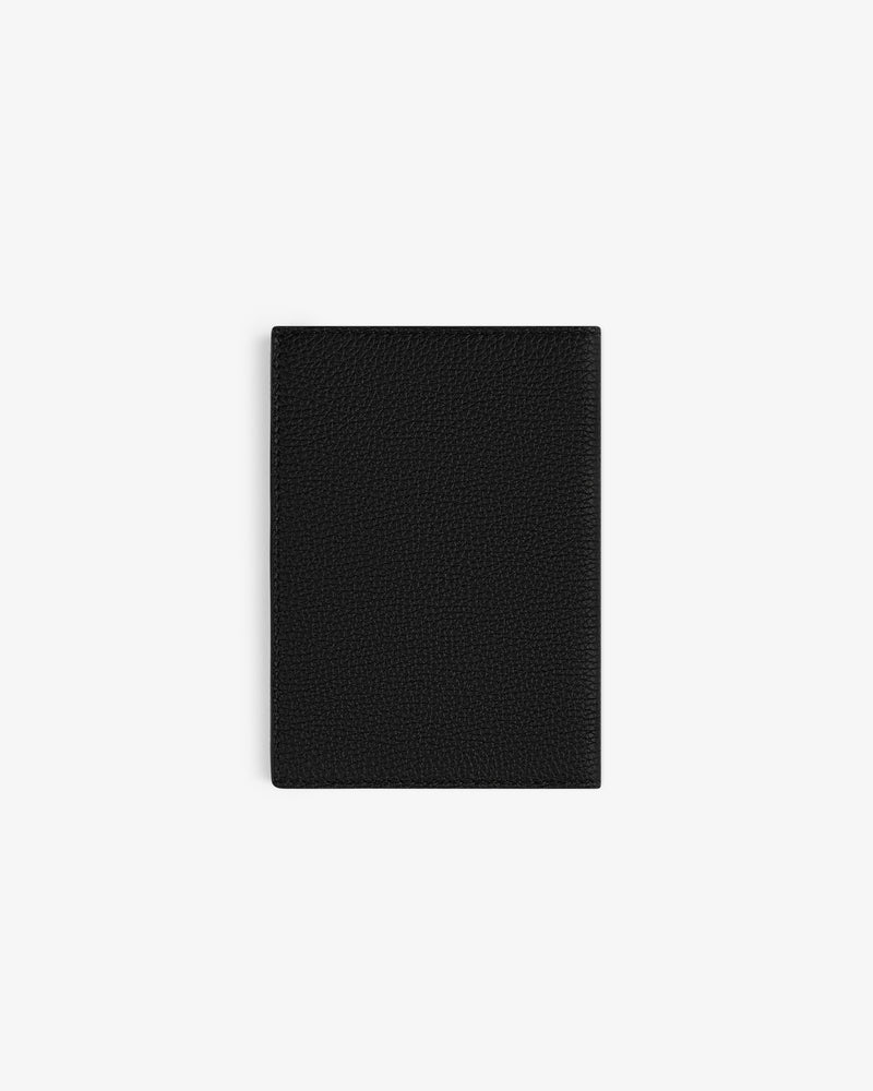 A closed, black Leather Passport Holder is centered on a white background.