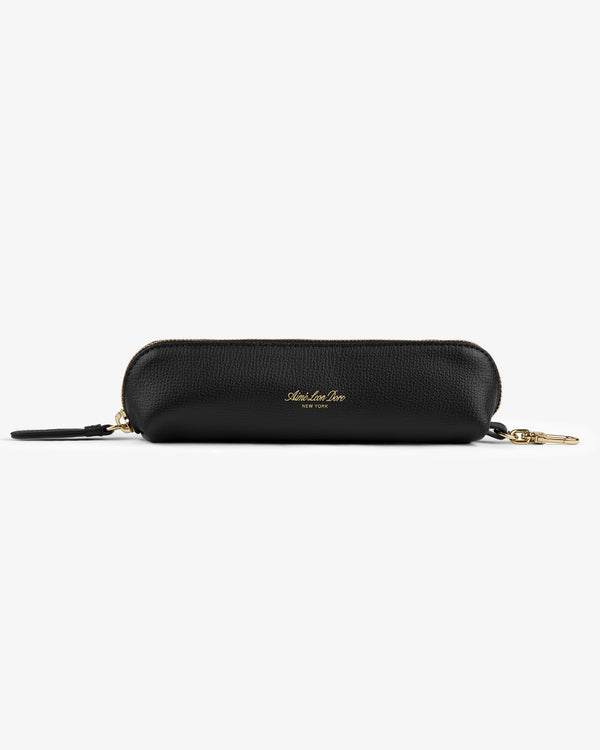 Leather Pencil Case in black with gold-tone zip, clasp, and a small gold logo on the front.