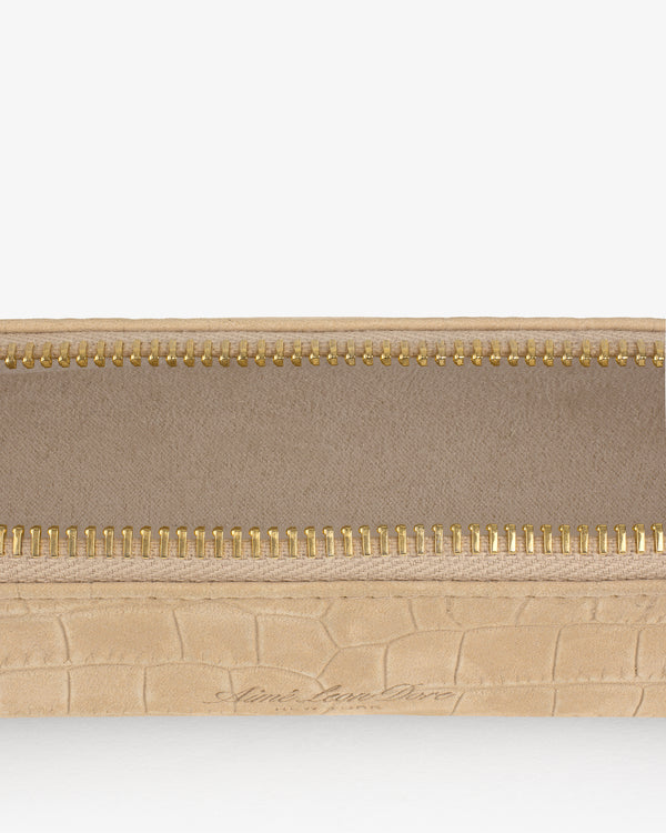 Close-up of the Croc-Embossed Nubuck Pencil Case with a gold zipper and visible fabric lining.