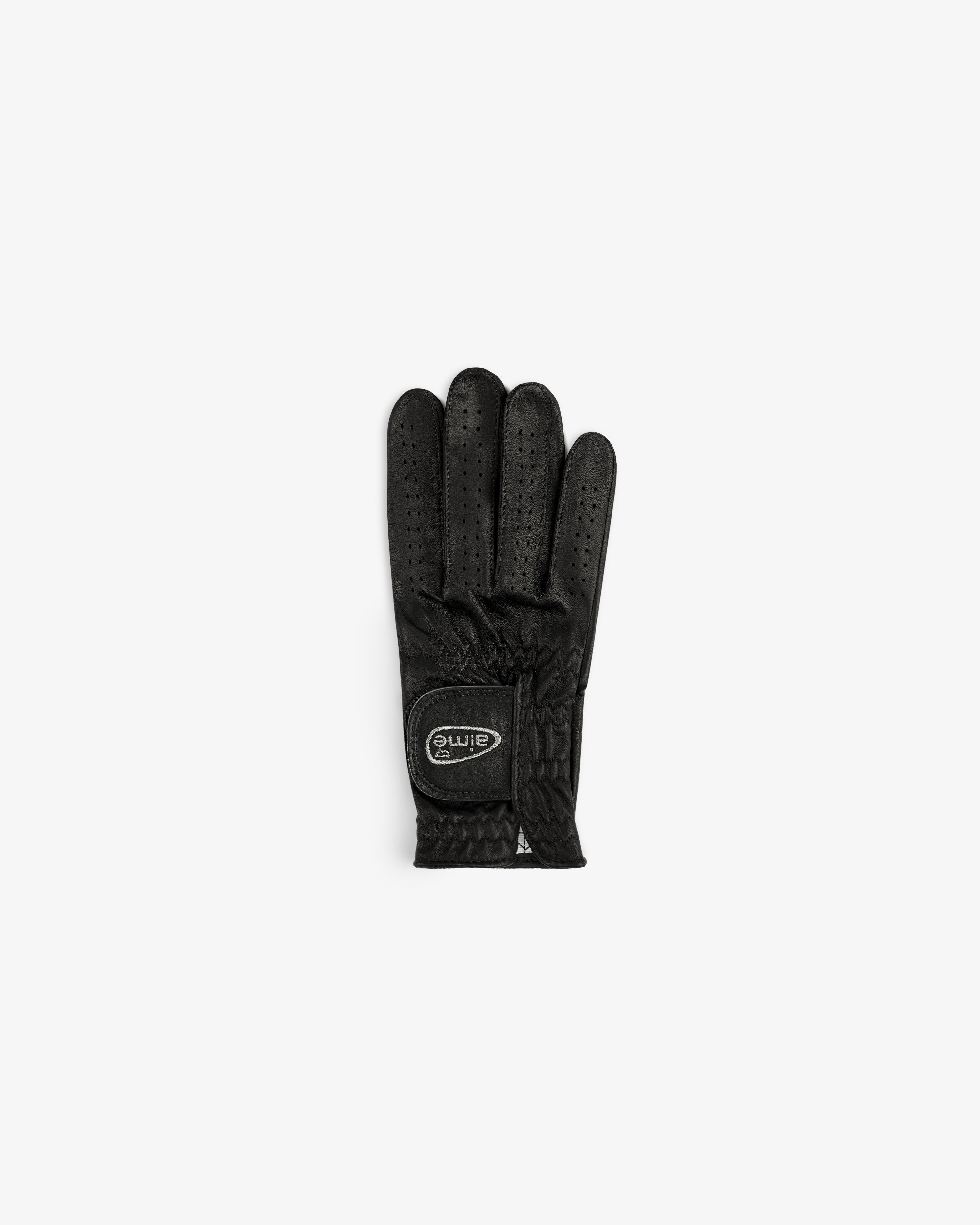 The ALD / FootJoy StaSof Heritage Glove (Right) is black leather with perforations, elastic wrist, and logo patch.