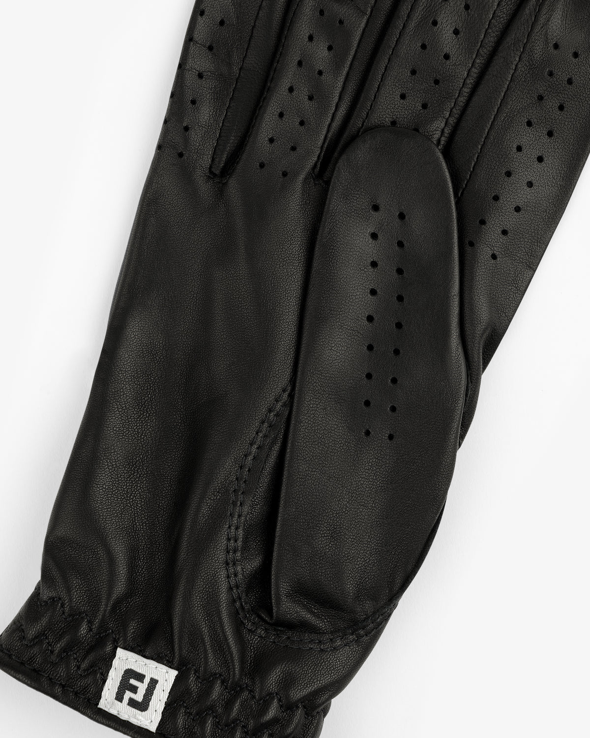 A black ALD / FootJoy StaSof Heritage Glove (Right) with small perforations and an FJ logo tag at the wrist.