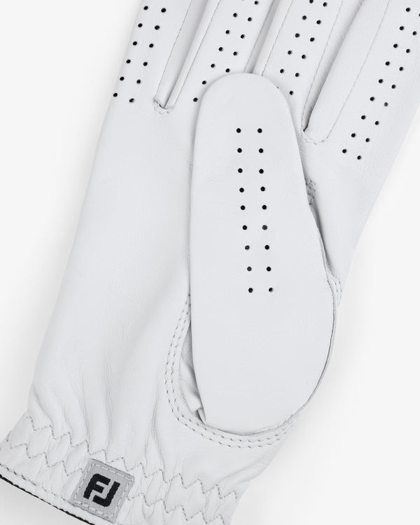 Close-up of the ALD / FootJoy StaSof Heritage Glove (Right) in white leather with perforations and FJ logo by wrist.