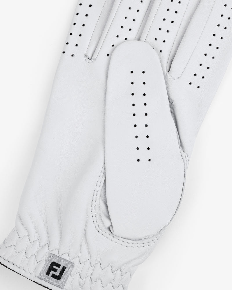 Close-up of the ALD / FootJoy StaSof Heritage Glove (Right) in white leather with perforations and FJ logo by wrist.