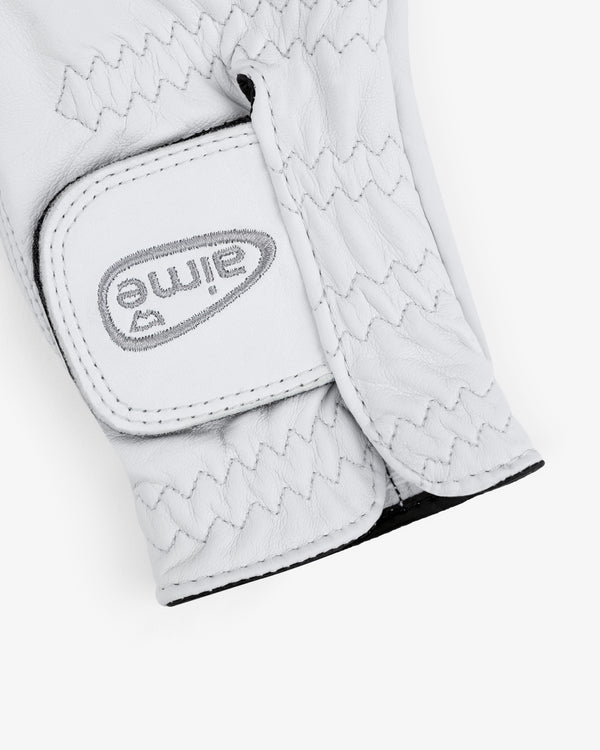 A close-up of the ALD / FootJoy StaSof Heritage Glove (Right) in white leather with visible stitching and a Velcro strap.