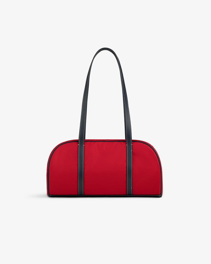 The Mini Duffle Shoulder Bag in red with black handles and trim, shown on a plain white background.