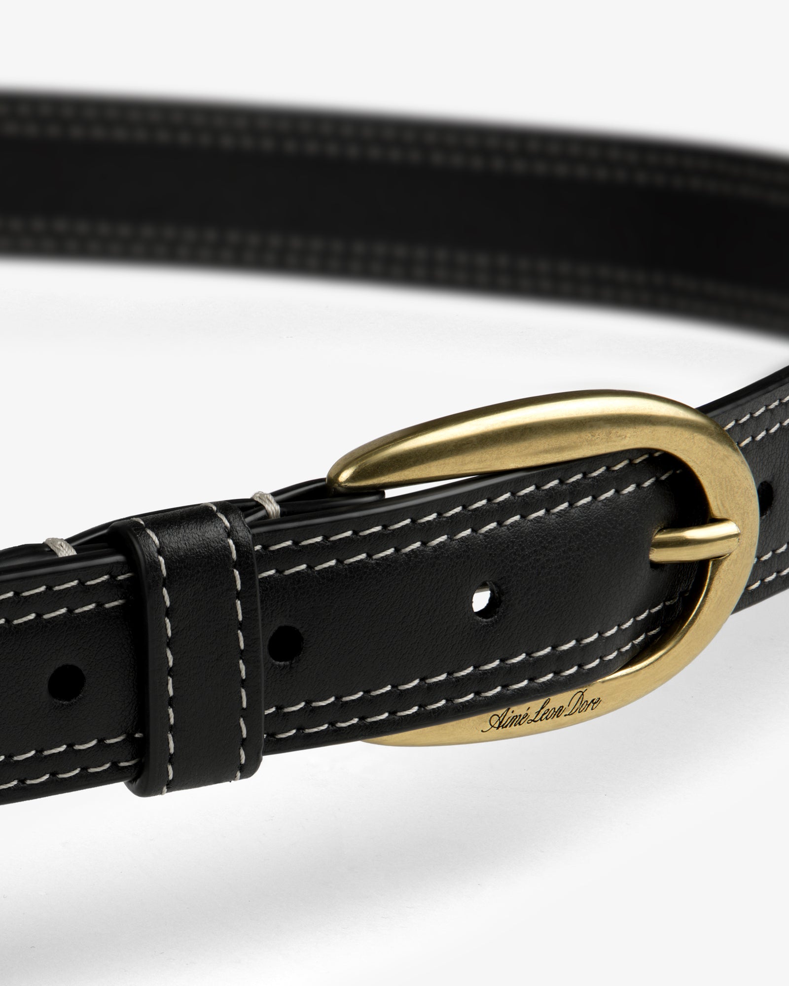 Convertible Leather Belt Bag in black leather with white stitching and a gold oval buckle on a white background.