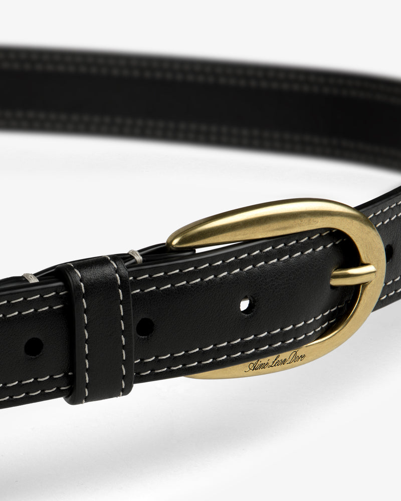 Convertible Leather Belt Bag in black leather with white stitching and a gold oval buckle on a white background.