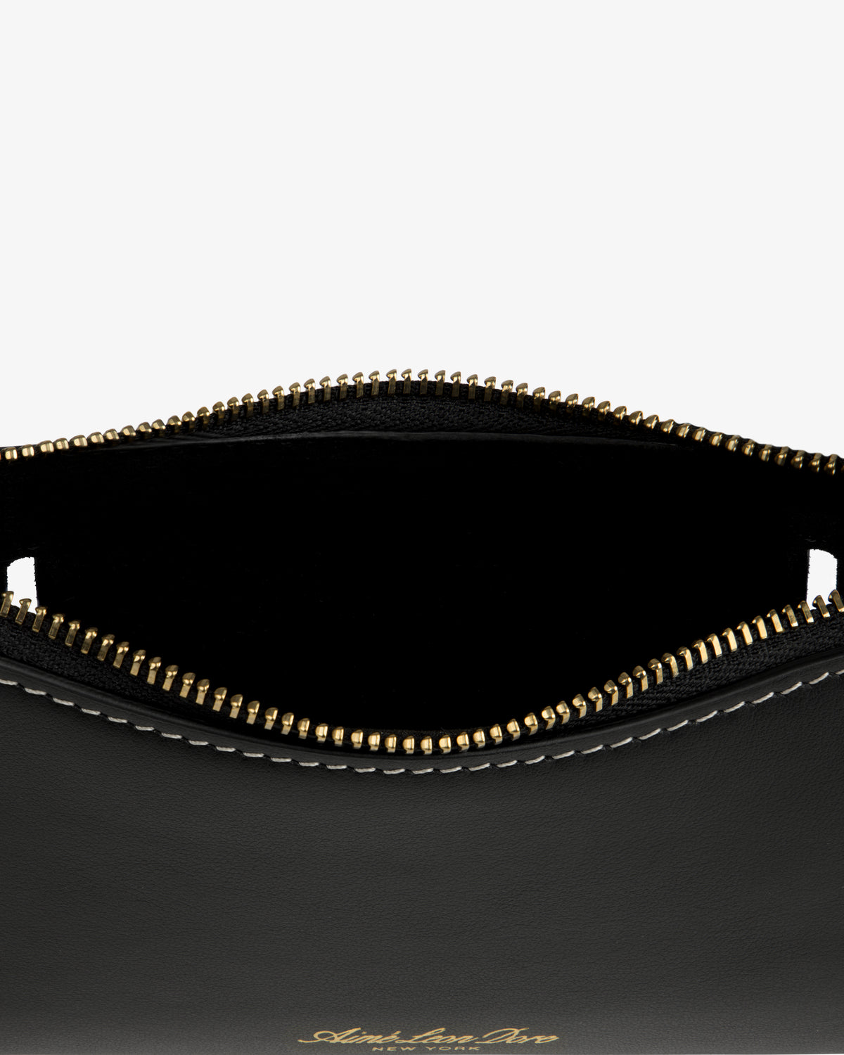 Convertible Leather Belt Bag in black leather with gold zipper, partial open top, and white edge stitching.