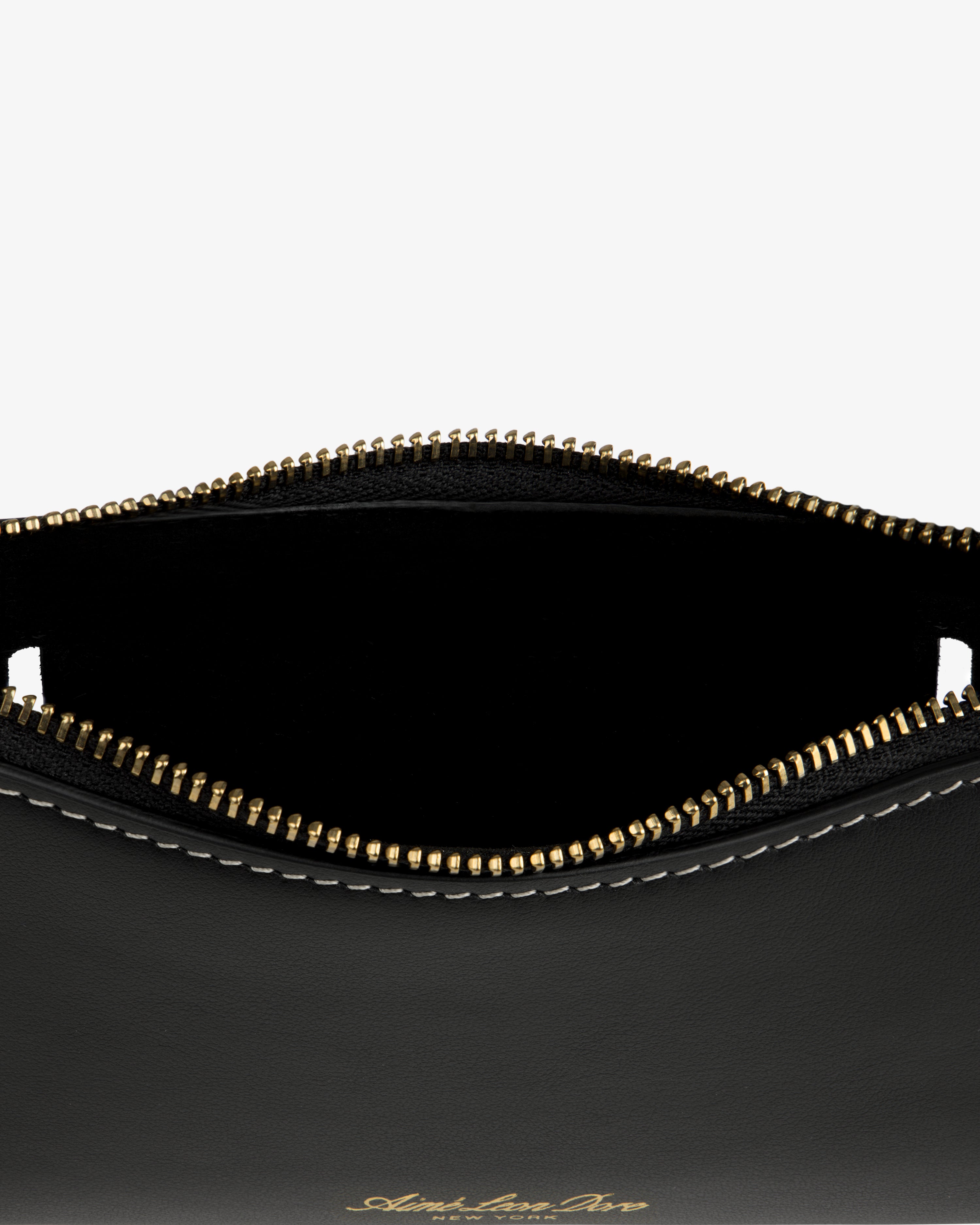 Convertible Leather Belt Bag in black leather with gold zipper, partial open top, and white edge stitching.
