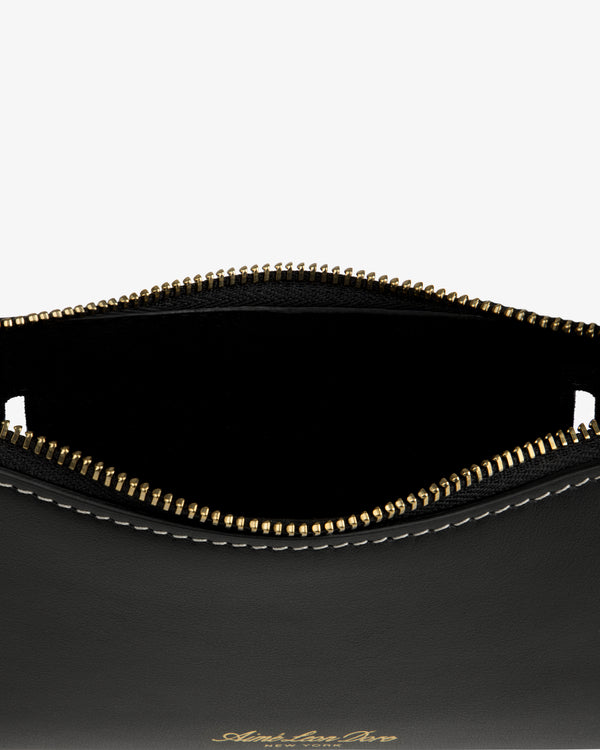 Convertible Leather Belt Bag in black leather with gold zipper, partial open top, and white edge stitching.
