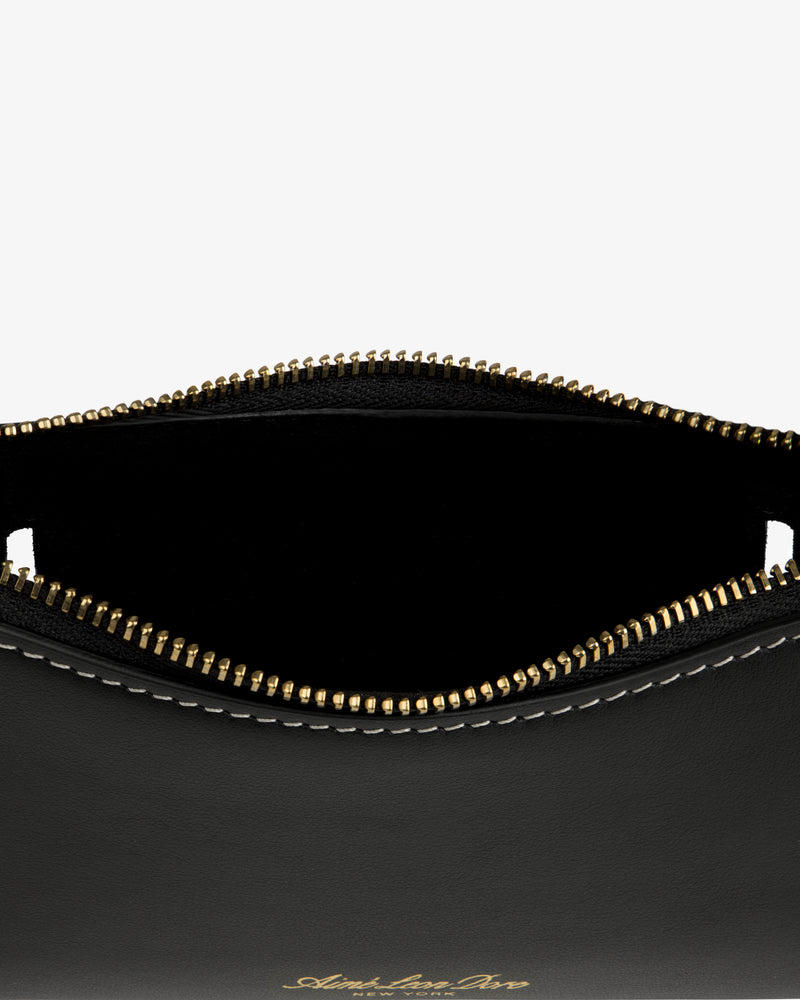 Convertible Leather Belt Bag in black leather with gold zipper, partial open top, and white edge stitching.