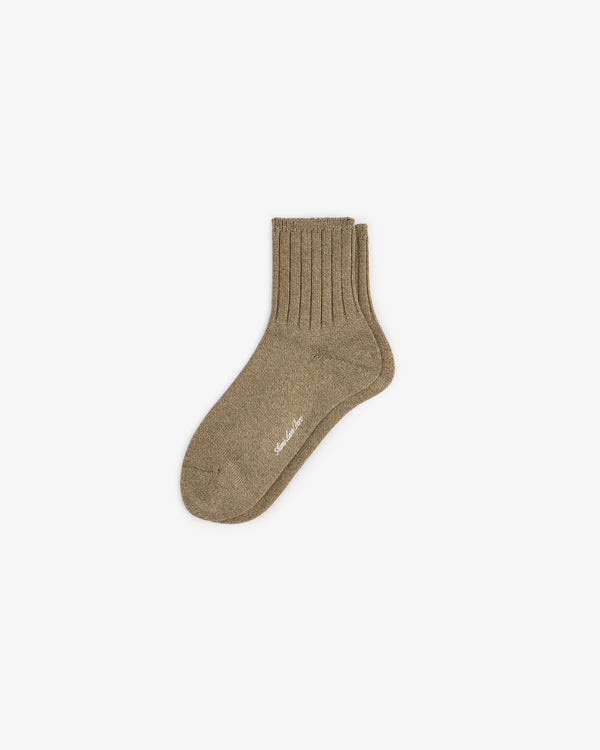 A single Marled Quarter Sock in brown, ribbed texture, displayed flat on a white background.