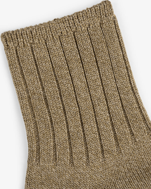 Close-up of a ribbed, tan Marled Quarter Sock against a white background.