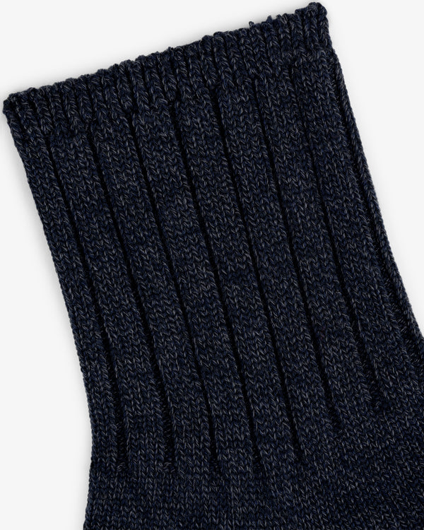 Close-up of the Marled Quarter Sock in dark blue, highlighting its ribbed knit texture and detailed pattern.