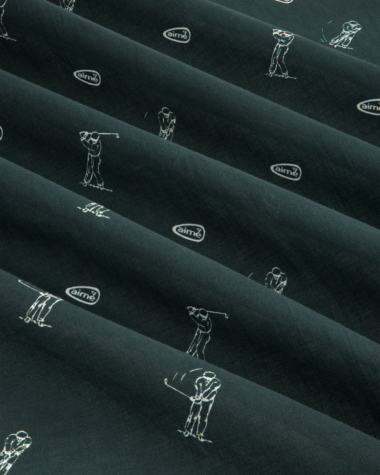 The ALD Golf Swing Bandana features dark fabric with white golfer line art and small airmx logos in diagonal rows.