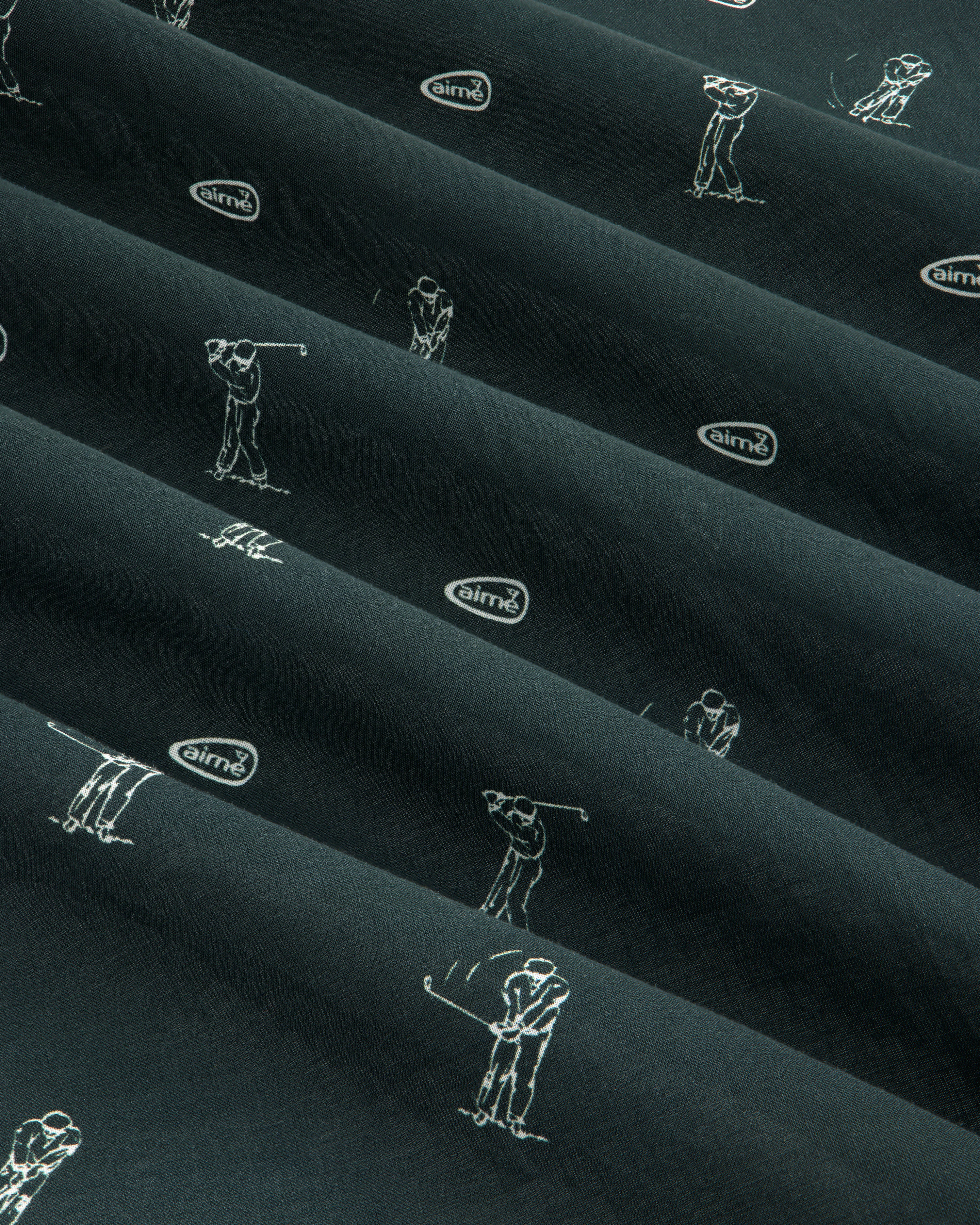 The ALD Golf Swing Bandana features dark fabric with white golfer line art and small airmx logos in diagonal rows.