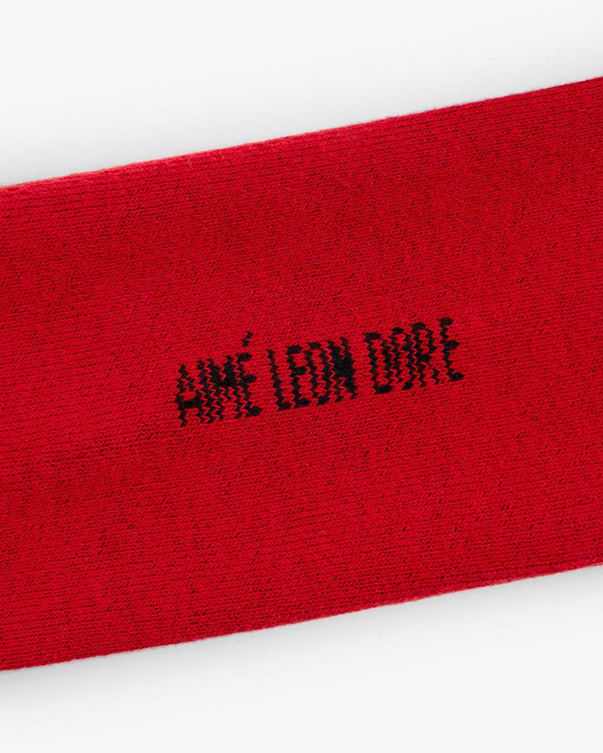 Red Crew Sock 3-Pack featuring "AIMÉ LEON DORE" stitched in black capital letters at the center.
