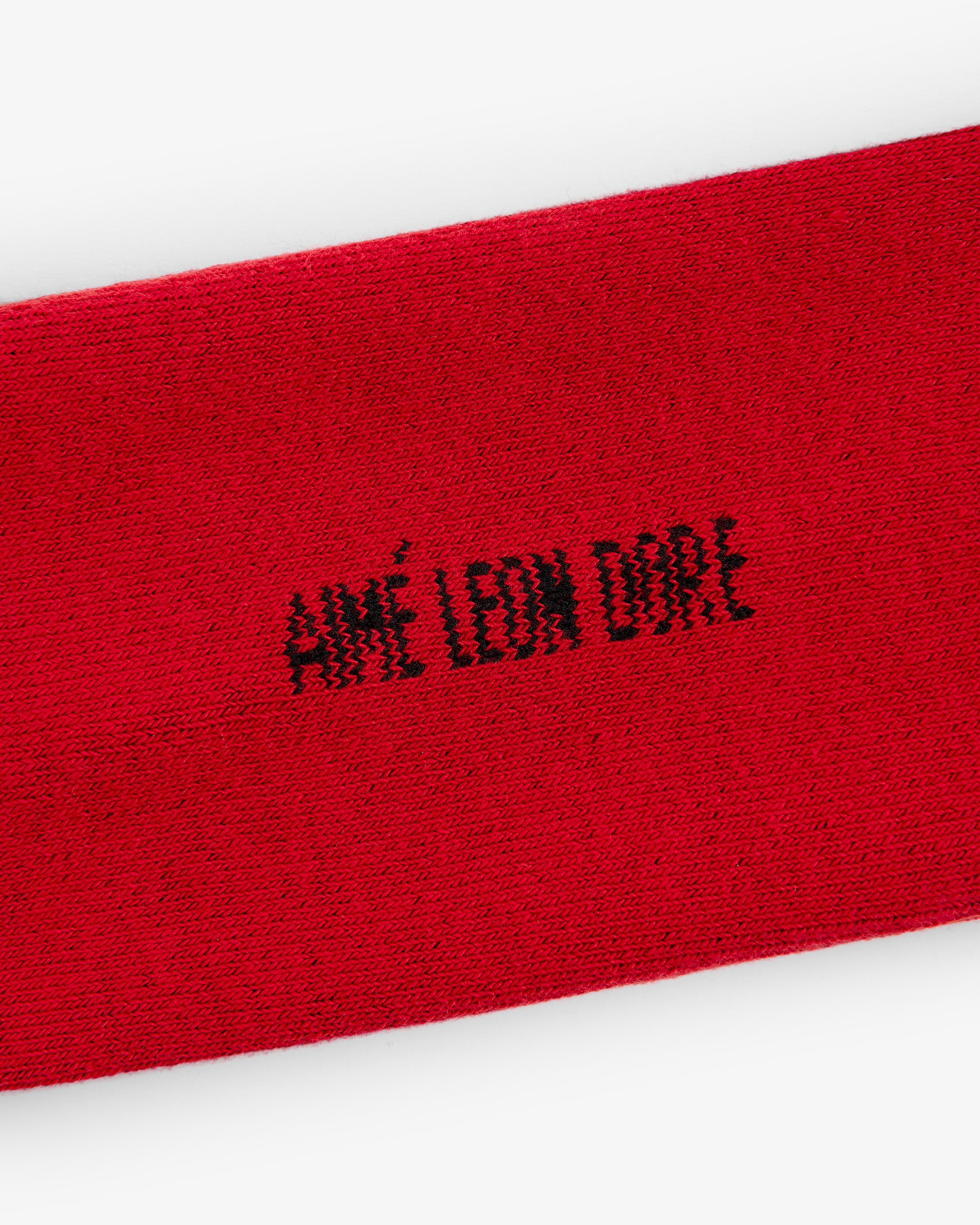 Red Crew Sock 3-Pack featuring "AIMÉ LEON DORE" stitched in black capital letters at the center.