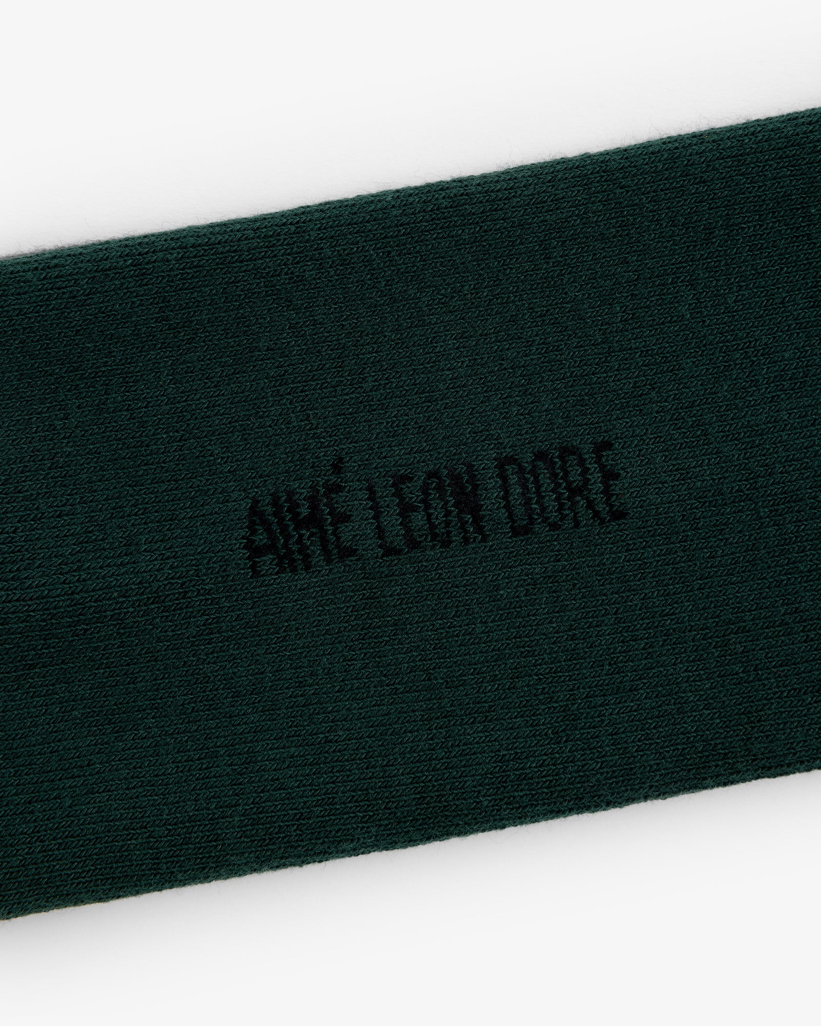 Dark green Crew Sock 3-Pack with AIMÉ LEON DORE embroidered in black at the center.
