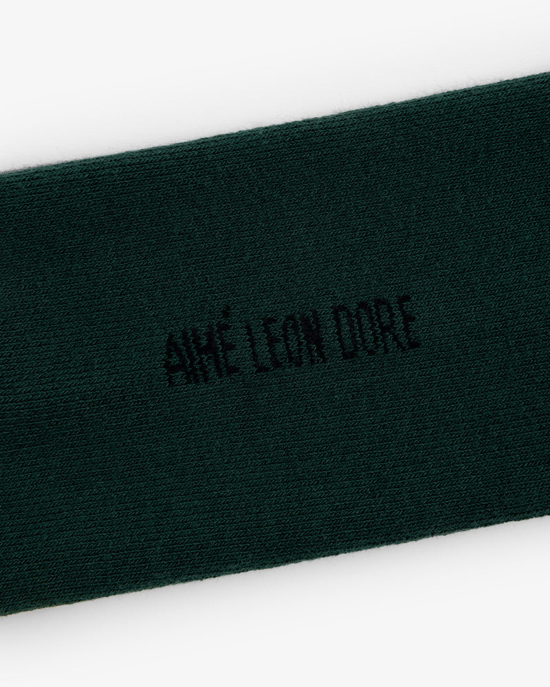 Dark green Crew Sock 3-Pack with AIMÉ LEON DORE embroidered in black at the center.