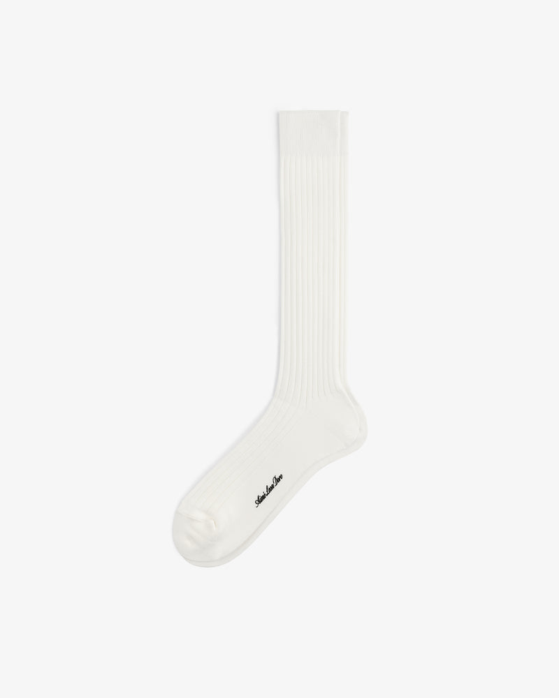 A single white Dress Sock with a ribbed crew design and small black logo near the toe on a plain white background.