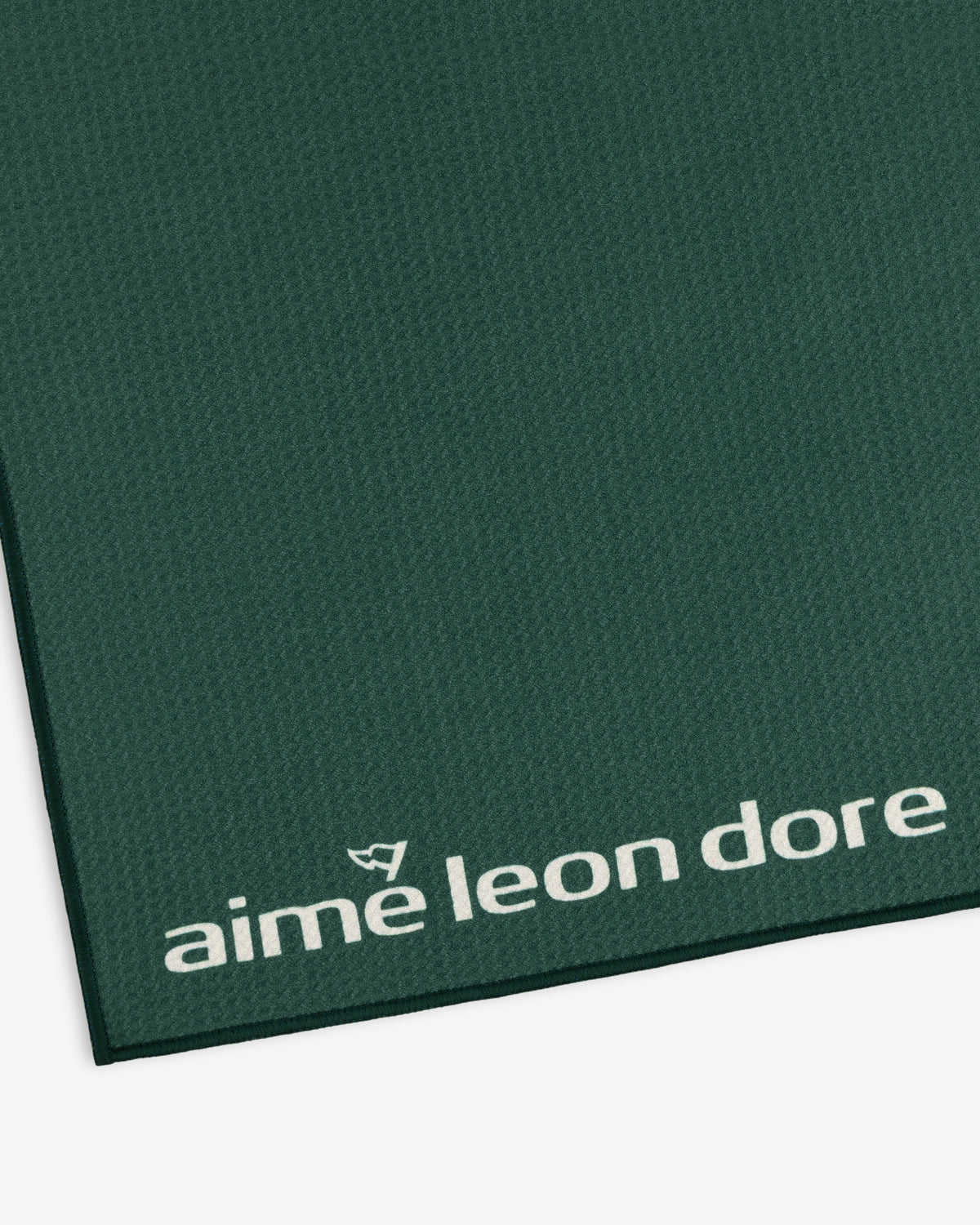 Green ALD Golf Caddy Towel with textured surface and small white aime leon dore logo in the bottom corner.
