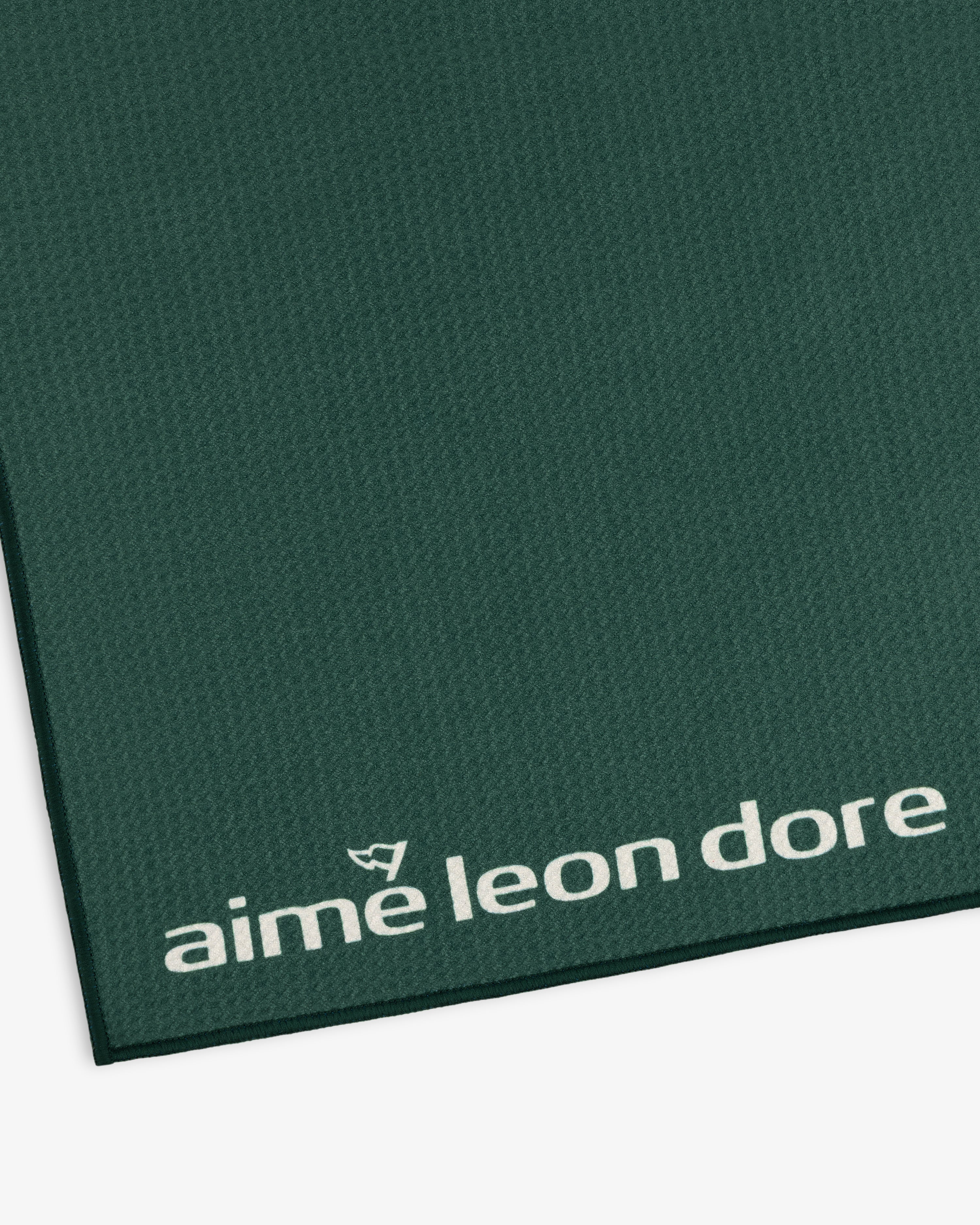 Green ALD Golf Caddy Towel with textured surface and small white aime leon dore logo in the bottom corner.