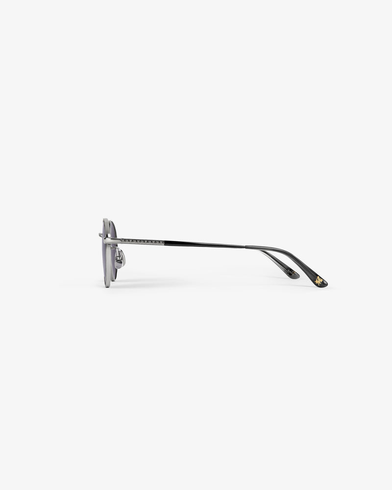 Side view of Giórgios Sunglasses—silver and black, round lenses, thin metal arms—on a plain white background.