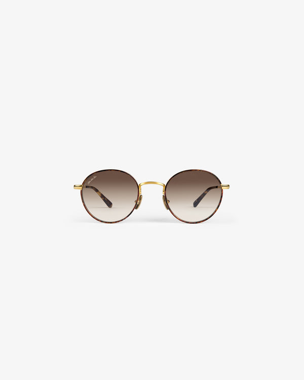 Giórgios Sunglasses: Round frames with brown gradient lenses, gold bridge, and thin gold arms on white background.