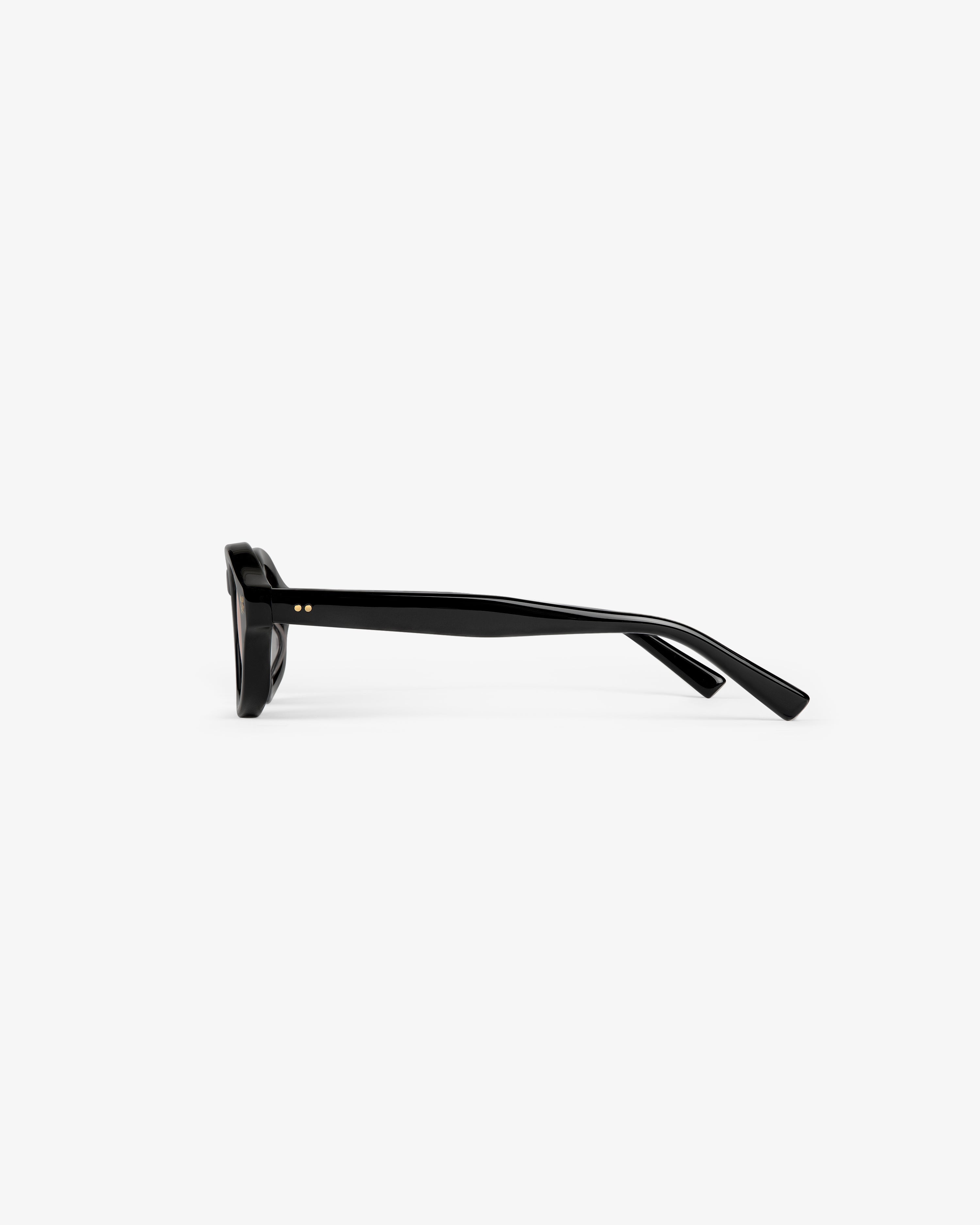 Side view of Onásis Sunglasses in black with thick, straight arms, shown against a plain white background.
