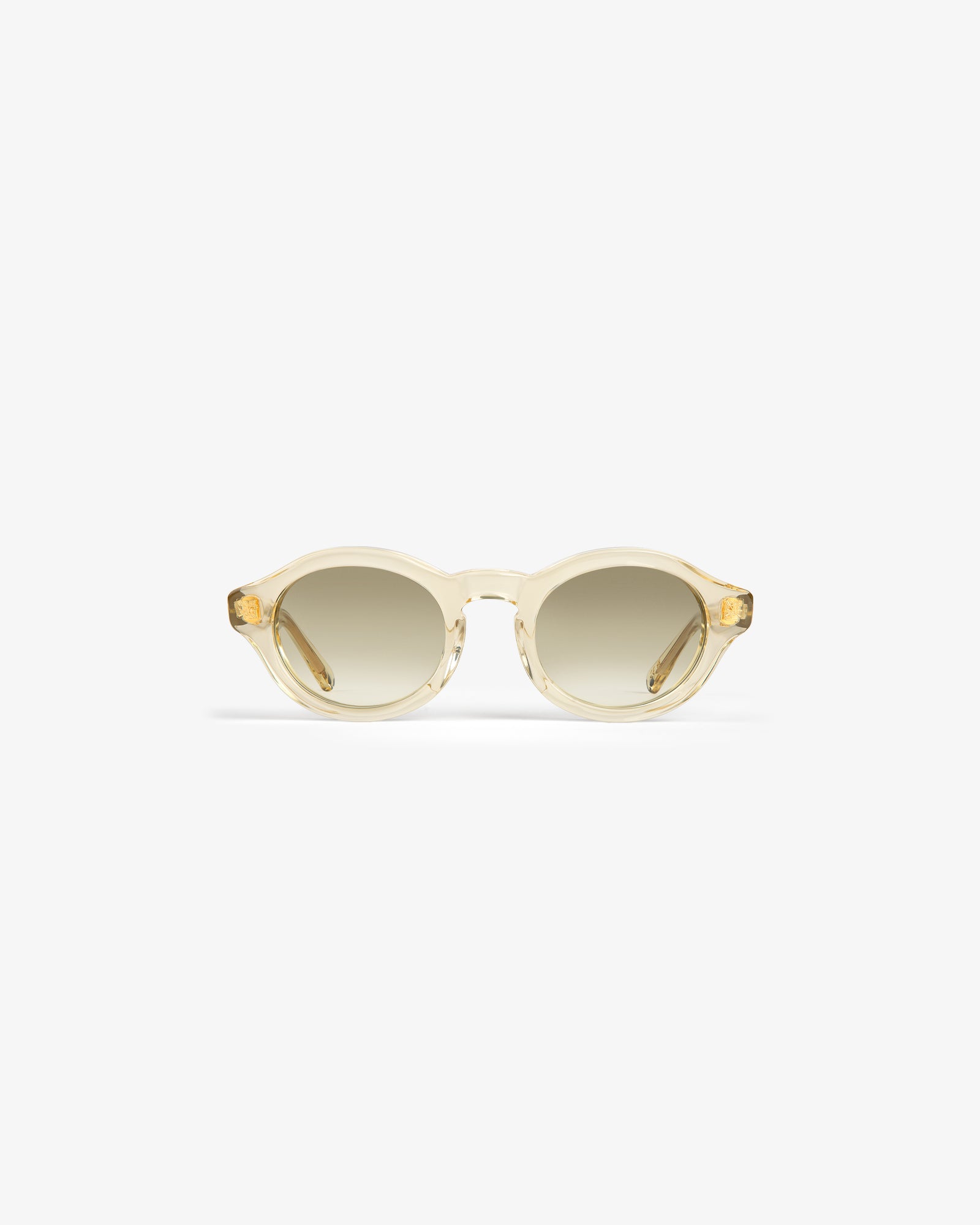 Onásis Sunglasses: round, translucent beige frames with light brown gradient lenses, shown on a white background.