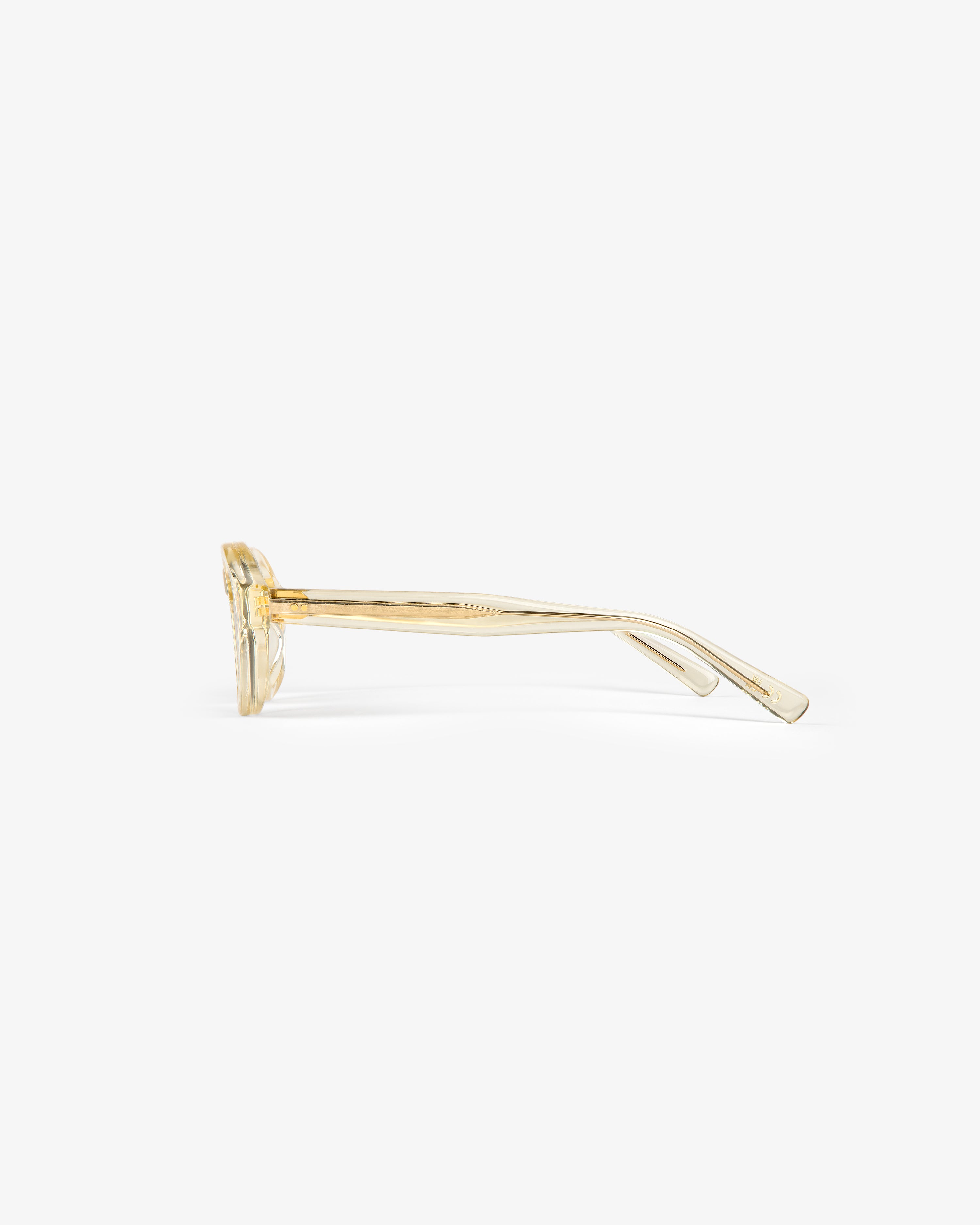 Side view of Onásis Sunglasses with clear yellow rectangular frames and slightly curved arms on a white background.