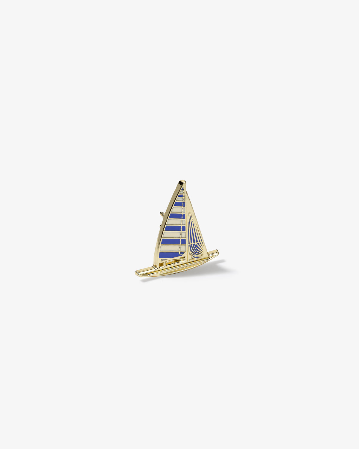 Graphic Pin featuring a gold and blue enamel sailboat with striped sails on a plain white background.