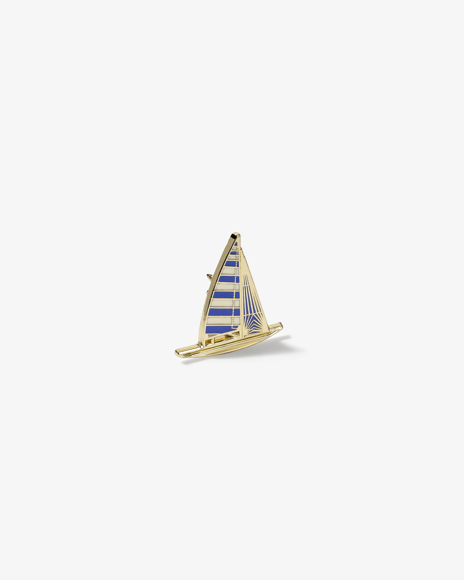 Graphic Pin featuring a gold and blue enamel sailboat with striped sails on a plain white background.