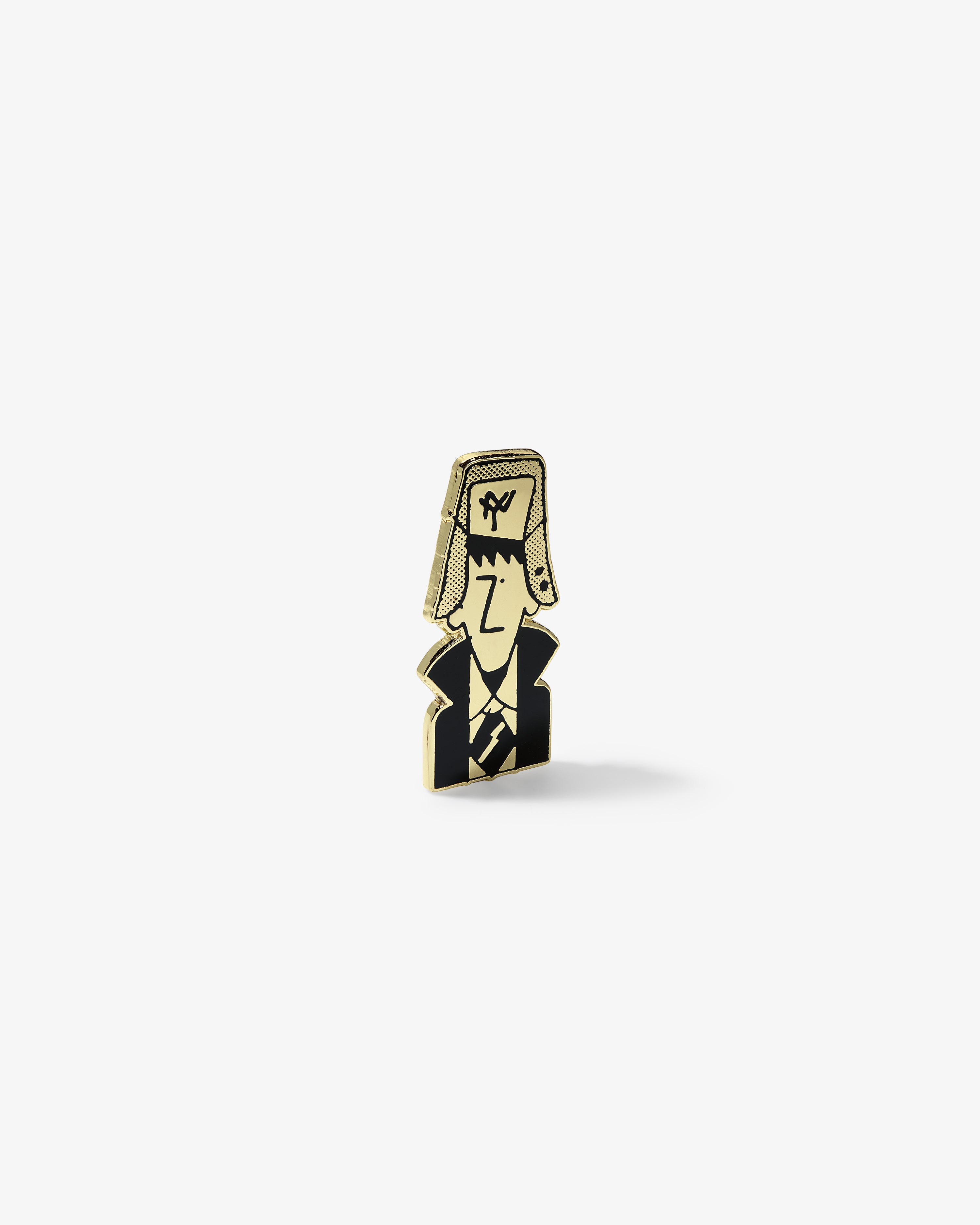 The Graphic Pin is a wooden game piece with a cartoon person in a tall hat and coat on a white background.