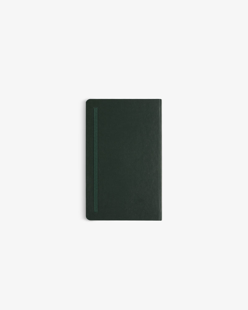 The Crest Sketchbook is a closed, dark green hardcover with an elastic band, centered on a plain white background.