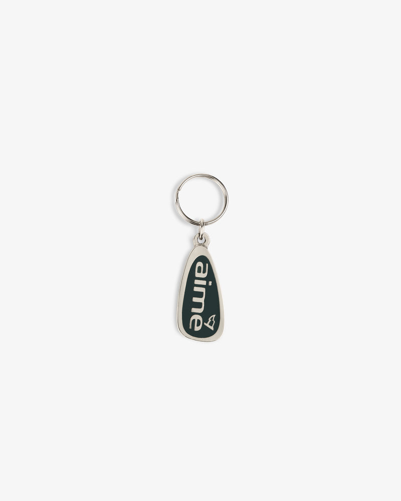 The ALD Golf Keychain is a silver keyring with a dark green teardrop tag that says "aime" in white letters.