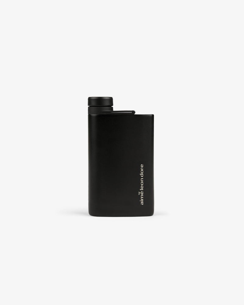 A sleek black ALD Golf 19th Flask with a screw cap and amir from circle printed vertically on the front.