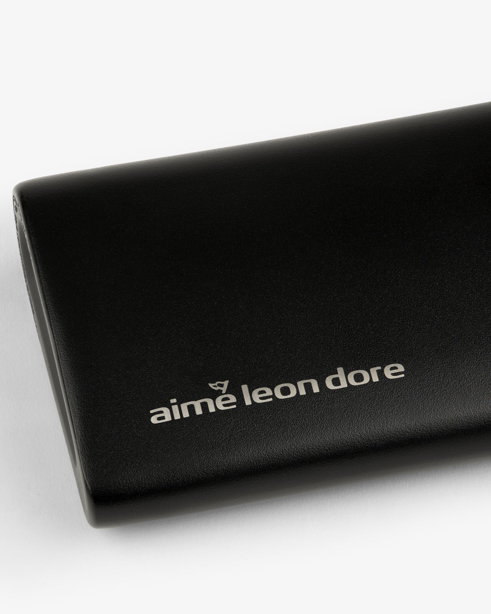 Black ALD Golf 19th Flask with "aime leon dore" in white lowercase on front, shown on a white background.