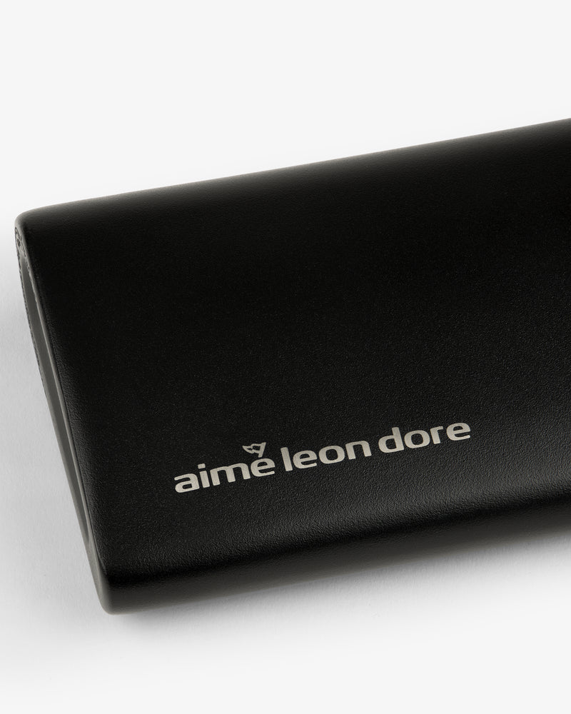 Black ALD Golf 19th Flask with "aime leon dore" in white lowercase on front, shown on a white background.