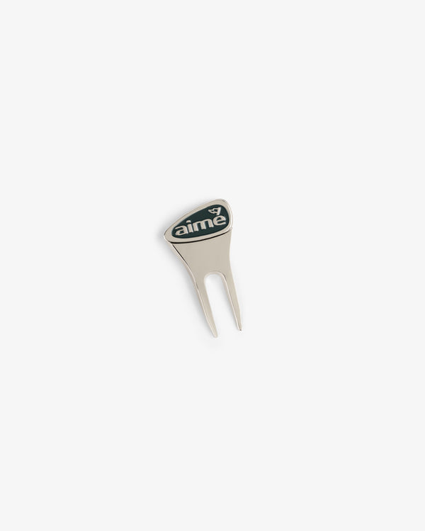The ALD Golf Divot Tool is silver with a black aime logo on a white background.