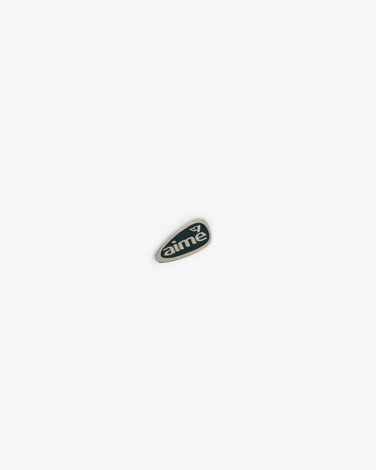 A small green ALD Golf Divot Tool with "aime" and a white bird logo on a plain white background.