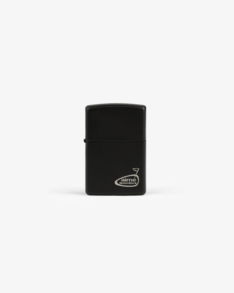 The ALD Golf Cigar Torch Lighter is black, rectangular, and features a small white Aimé Leon Dore logo in the corner.