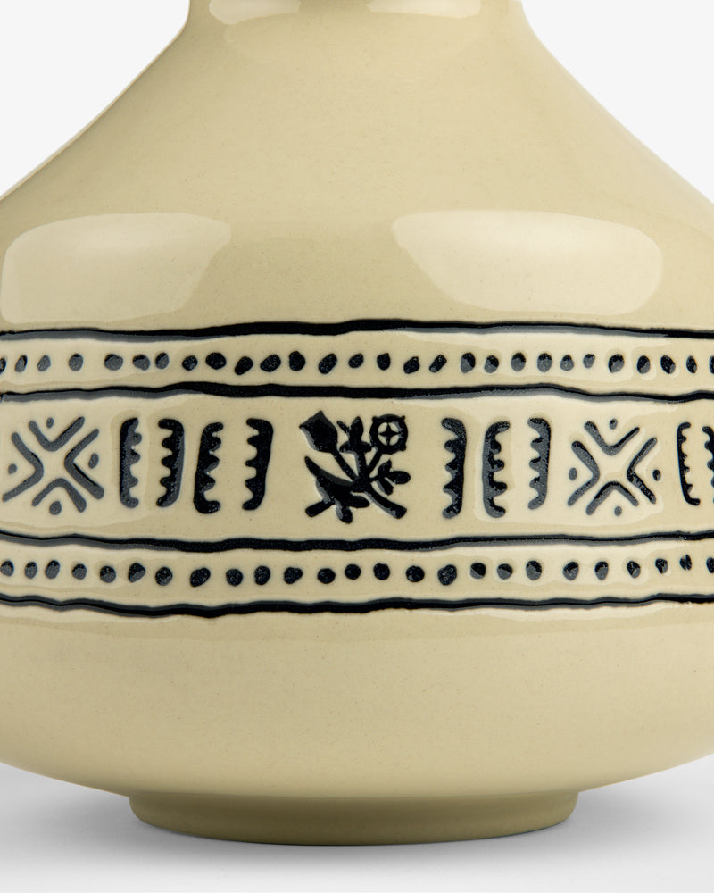 Close-up of a Textile Patterned Bud Vase in beige ceramic with black patterns and a small midsection flower design.