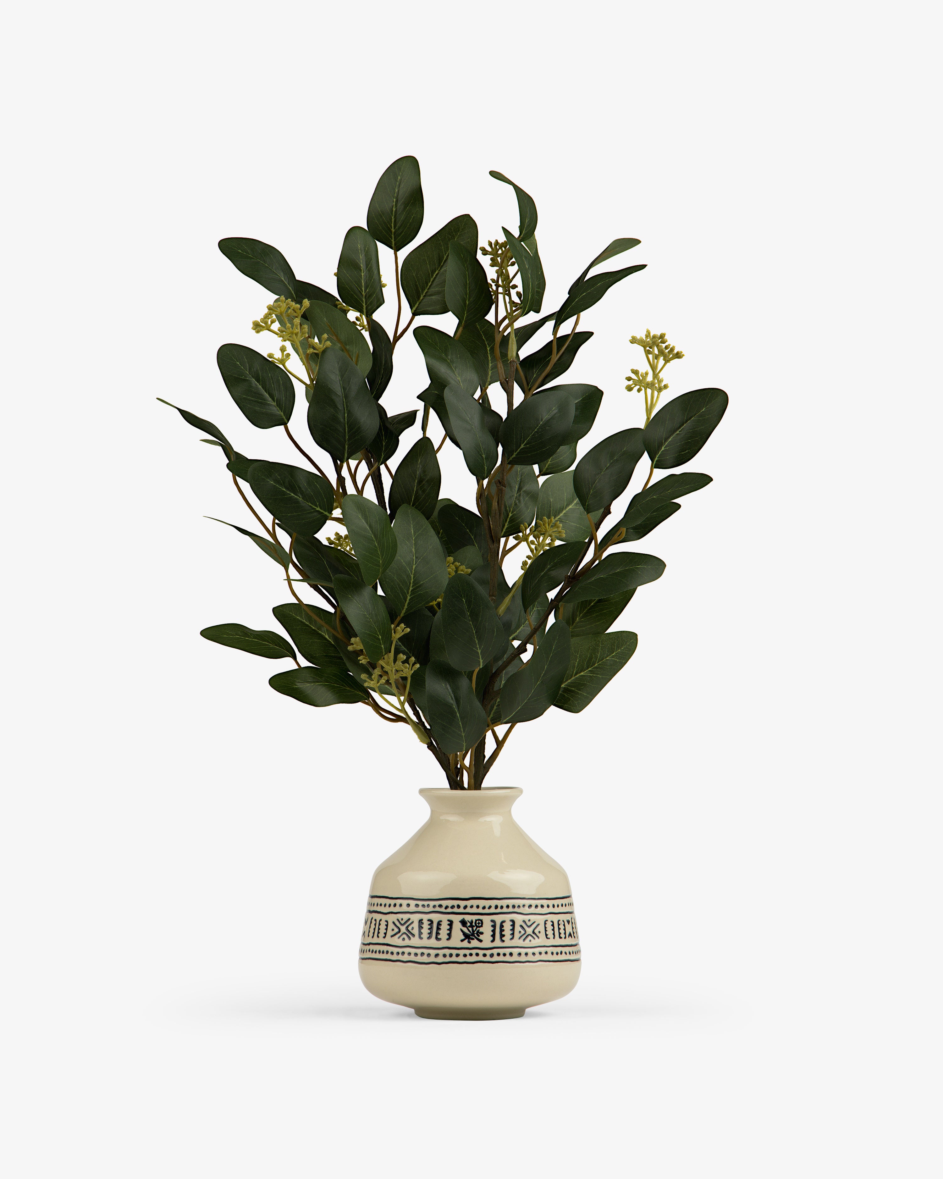 A leafy green plant with yellow buds in the Textile Patterned Bud Vase.